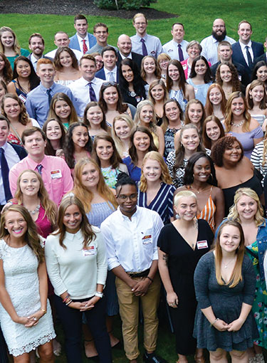 A group of student leaders pose with President Rooney.