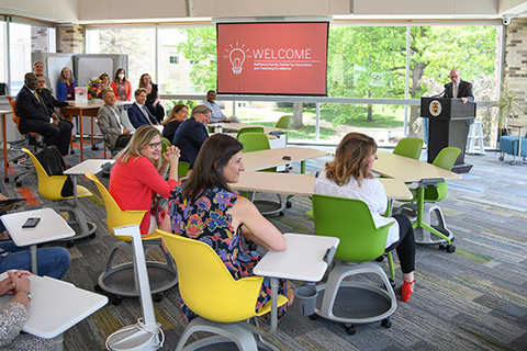 A group of Fisher community members seated during a presentation at the DePeters Family Center.